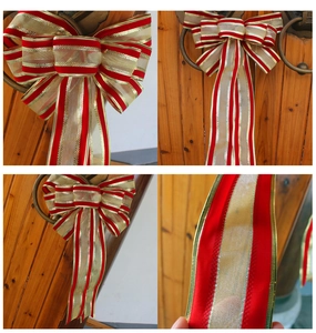 Detail view of large red and gold striped Christmas bow ornaments for holiday door decor