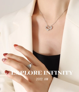 Chic silver liquid heart pendant necklace and textured ring set on female model