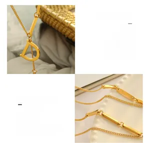 Detailed close-up of 18K gold plated titanium steel D-pendant necklace with bamboo links
