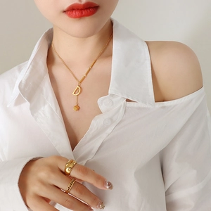 Elegant 18K gold plated titanium steel necklace with D-letter and cube pendant