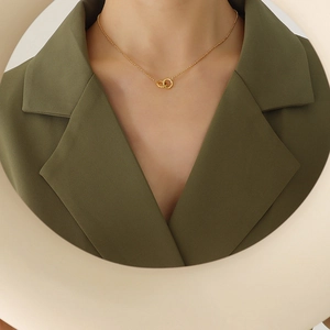Minimalist interlocking double ring pendant necklace in 18K gold plated titanium steel