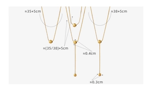 Detailed view of layered gold bead necklace with length measurements and sizing guide