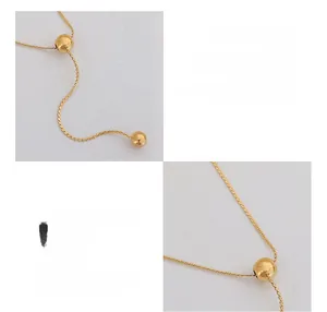 Detail of 18K gold plated titanium steel double-layer necklace with sliding beads