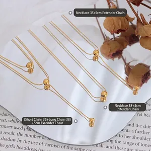 Minimalist gold double layer bead necklace in titanium steel with mirror reflection view