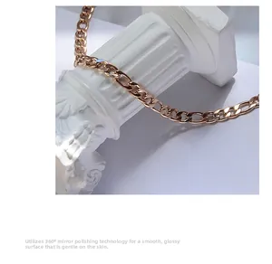 Macro shot of rose gold chain on stone column showing 360 degree mirror polish detail