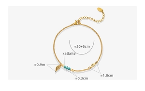 Détails de la chevillère plaquée or avec perles turquoise et pendentif en plume