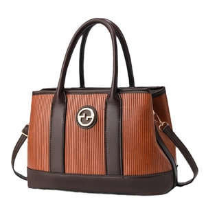 Fashionable contrast color striped handbag in orange and chocolate brown PU leather