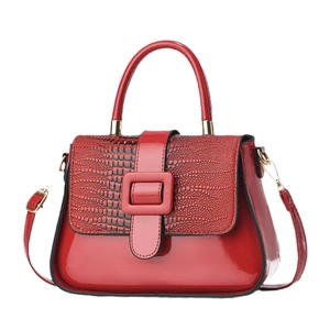 Red patent leather handbag with crocodile pattern panel and square buckle detail