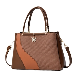 Women's color block handbag with woven texture, butterfly charm and shoulder strap