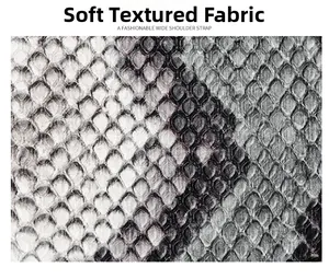 Close-up of soft faux leather material with black and white snake skin pattern texture