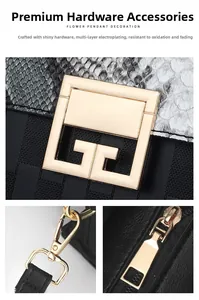 Close-up of golden square metal lock and strap D-ring on snakeskin textured handbag
