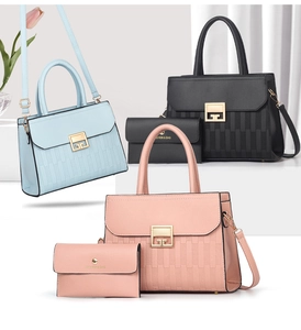 Detail of multi-color tote bags with vertical stripe texture and gold square metal locks