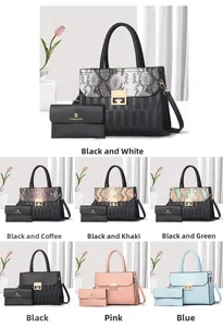 Detail view of large women's tote bag and mini purse set with G-shaped golden hardware