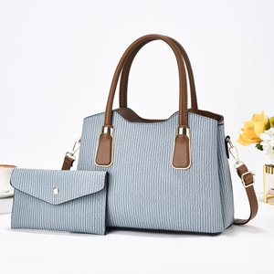 Striped light blue PU leather tote bag set with brown handles and a matching wallet
