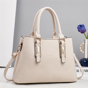 Elegant beige lychee grain faux leather handbag with dual handles and gold hardware