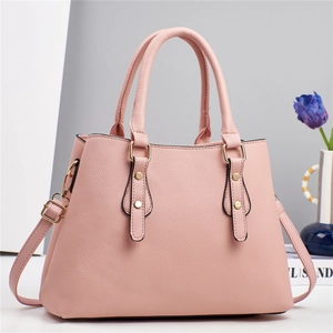 Pink multi-layer leather handbag with gold hardware and detachable shoulder strap