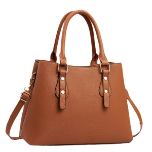 Brown litchi grain leather tote bag with dual handles and gold hardware details