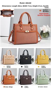 Detail showing the vertical pleated texture and metal twist lock of the striped handbag
