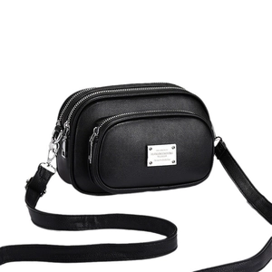 Black multi-layer crossbody bag with premium pebbled leather and silver zippers