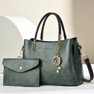 Green embossed tote bag set with detachable strap and elegant pearl charm for women