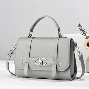 Grey lychee pattern leather handbag with silver CD buckle and adjustable shoulder strap
