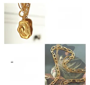Detailed macro view of an 18K gold-plated double-layer necklace with irregular pendant