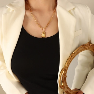 Double-layered gold-plated stainless steel necklace with irregular geometric lava pendant