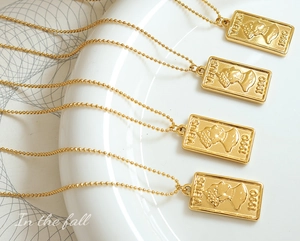 Detail of gold Venus coin pendant on beaded chain made of non-fading titanium steel