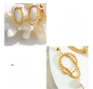 Detail of double-layer bead chain earrings with freshwater pearls in 18K gold plated steel
