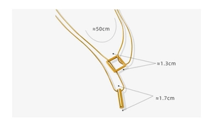 Detail view of double-layered gold snake chain necklace with square and cylinder charms