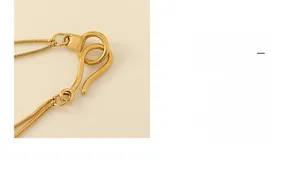 Detail of gold multi-layer snake chain with S-hook clasp and vintage matte finish