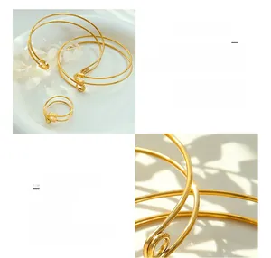 Detailed views of 18K gold plated titanium steel open cross bracelet and ring set