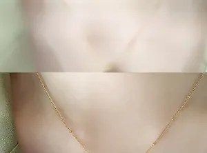 Detail of 18K gold plated beaded chain necklace showing delicate minimalist texture