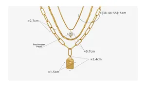 Macro view of triple-layered gold necklace showing freshwater pearl and embossed pendant