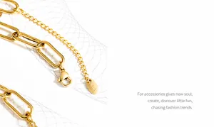 Close-up of gold paperclip chain necklace showing lobster clasp and K18 tag detail