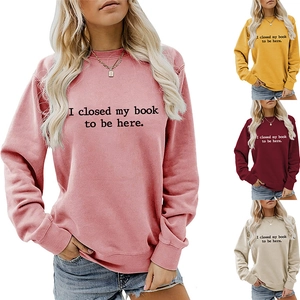 Detail view of multicolored crewneck sweatshirts with I closed my book letter print