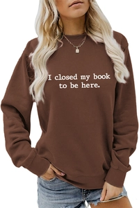 Detail of white slogan print on premium brown crewneck long sleeve sweatshirt