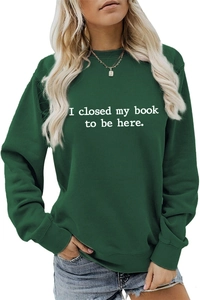 Close-up of white artistic lettering printed on a dark green casual sweatshirt