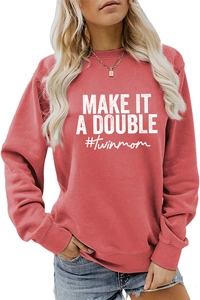 Close-up of brick red crewneck sweatshirt with white Make It A Double twinmom text