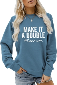 Close-up of ribbed cuffs and white 'MAKE IT A DOUBLE' letter print on blue grey sweatshirt