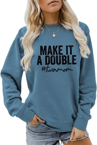 Close-up of blue sweatshirt with 'MAKE IT A DOUBLE #twinmom' lettering and ribbed cuffs
