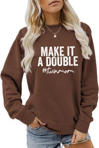 Detail of dark brown sweatshirt with white Make It A Double and #twinmom print