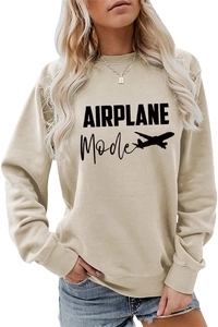 Détail de l'inscription AIRPLANE Mode et silhouette d'avion sur un sweat beige femme