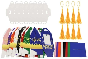 Close-up of Graduation Muffin Box kit with colorful paper boxes and yellow silk tassels