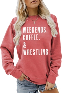 Detail of red crewneck sweatshirt featuring white Weekends Coffee wrestling typography