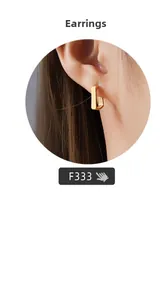 Close-up of minimalist rectangular gold earrings with a polished mirror finish surface