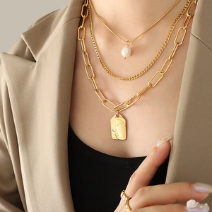 Three-layer stacked gold necklace with freshwater pearl and rectangular portrait pendant