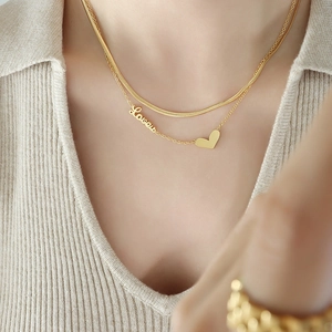 Chic gold double-layer necklace featuring a flat snake chain and a heart love pendant