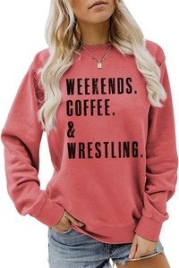 Close-up of brick red crewneck sweatshirt with black WEEKENDS COFFEE WRESTLING text print