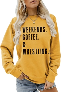 Detail of letter print on ginger yellow crewneck sweatshirt with comfortable cotton texture